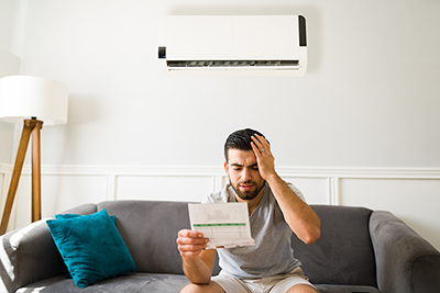 Worried man looking at his bills
